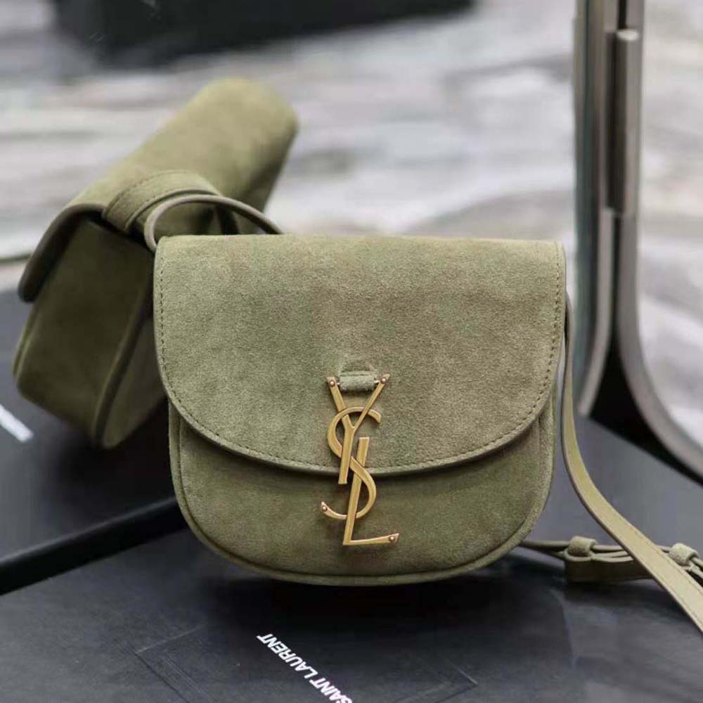 Close-up of gold YSL logo hardware on Kaia Small Satchel suede bag
