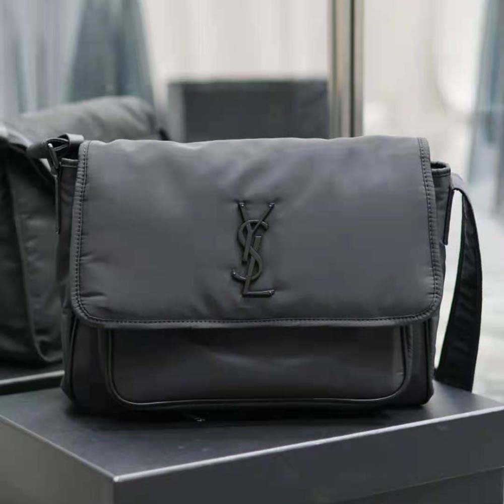 Close-up of gold YSL logo and zipper on Niki Messenger bag