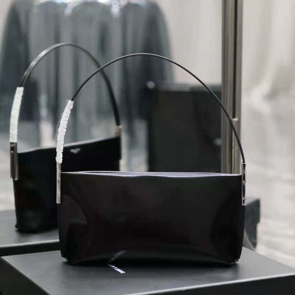 Side angle showing glossy black leather and flap closure on Saint Laurent YSL Women Suzanne Small