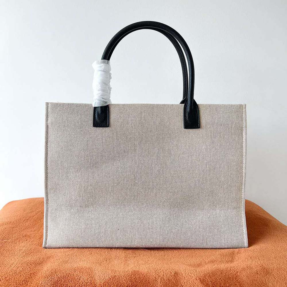 Side angle showing zip closure of Versace Women La Medusa Canvas Large Tote Bag-Beige