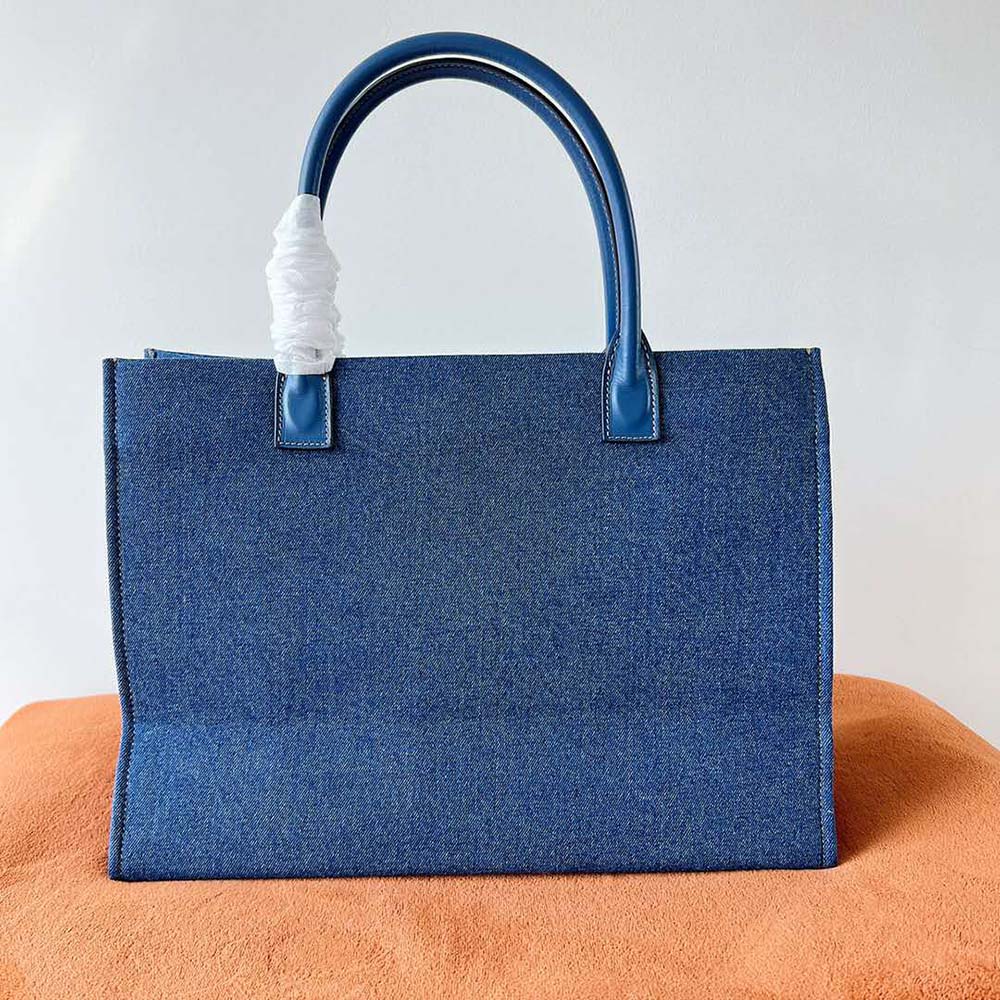 Side profile showing spacious interior of Versace Women La Medusa Denim Large Tote Bag-Blue