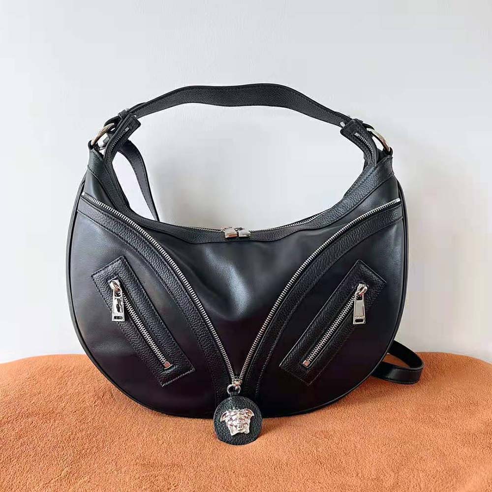 Close-up detail of gold-tone hardware on Versace Women Repeat Hobo Bag-Black