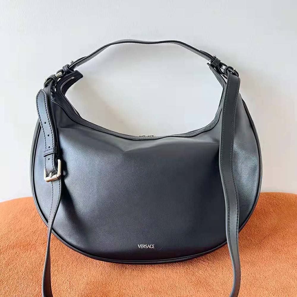 Side angle of Versace Women Repeat Hobo Bag-Black highlighting silhouette