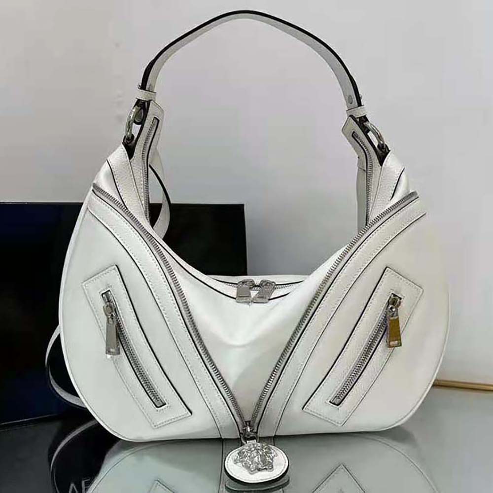 Close-up of gold Medusa logo detail on Versace Women Repeat Hobo Bag-White