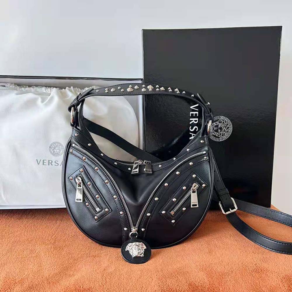 Side profile showing silhouette of Versace Women Repeat Small Hobo Bag-Black