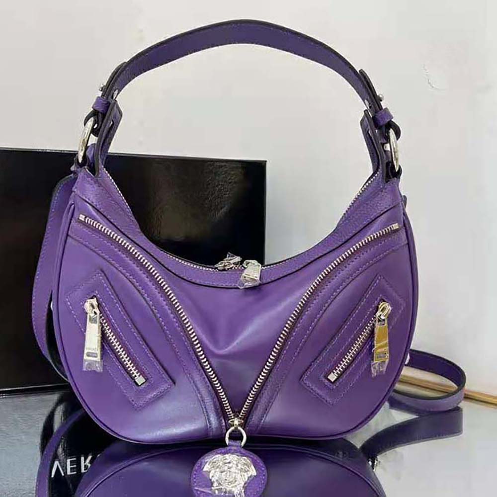 Close-up of gold hardware and zipper on Versace Women Repeat Small Hobo Bag-Purple