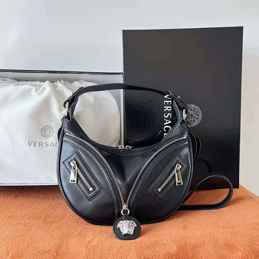 Side profile of Versace Women Repeat Small Hobo Bag highlighting leather texture