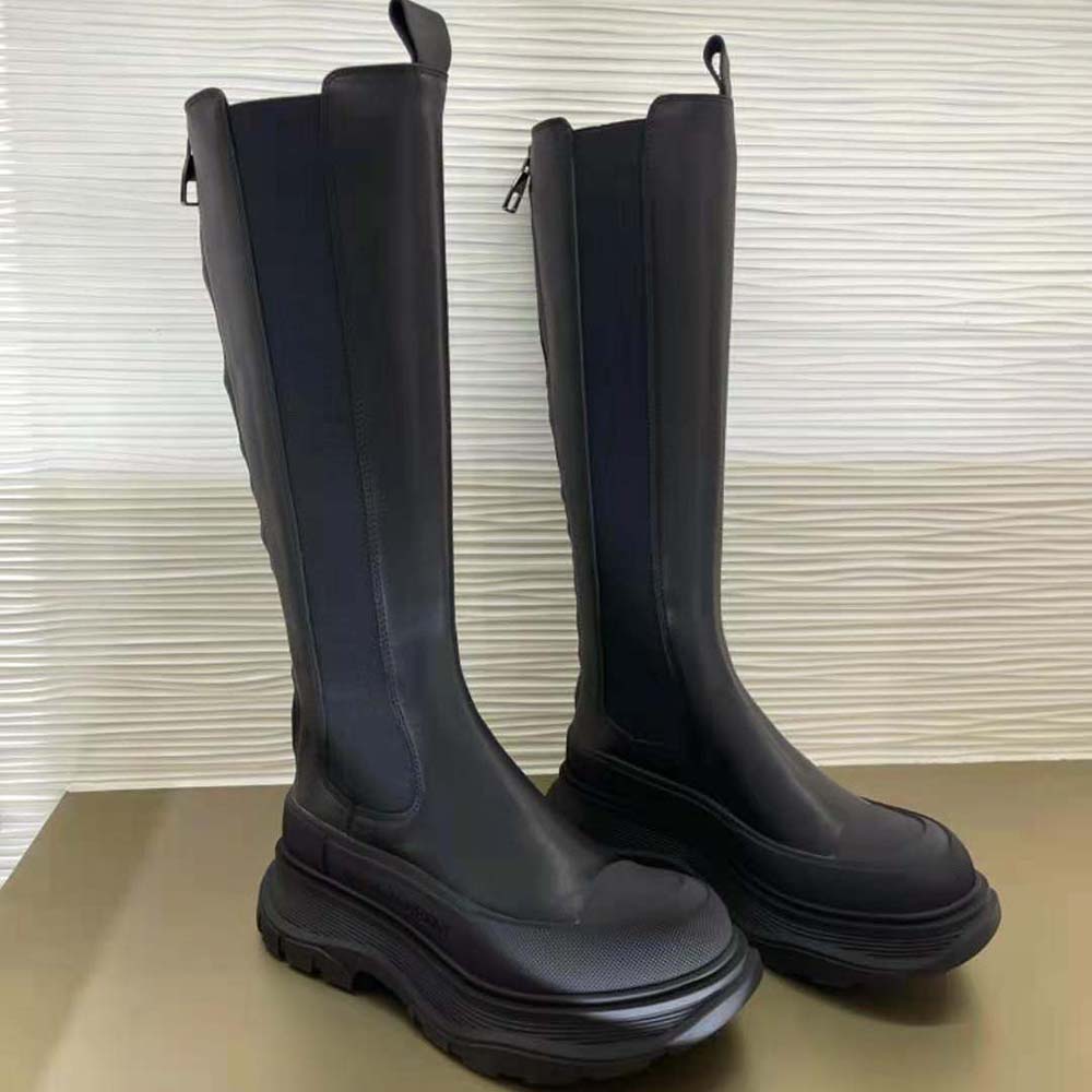 Front view highlighting lace-up and tongue detail of Alexander Mcqueen knee boot
