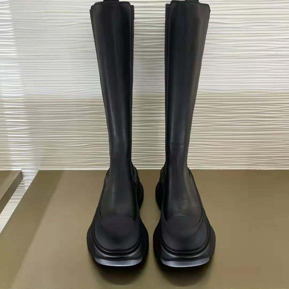 Close-up of chunky tread sole on Alexander Mcqueen Women knee high boot