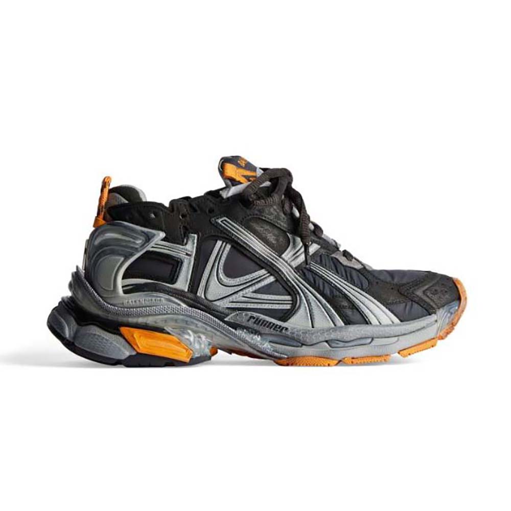 Side view of Balenciaga Unisex Runner Sneaker showing neon orange accents