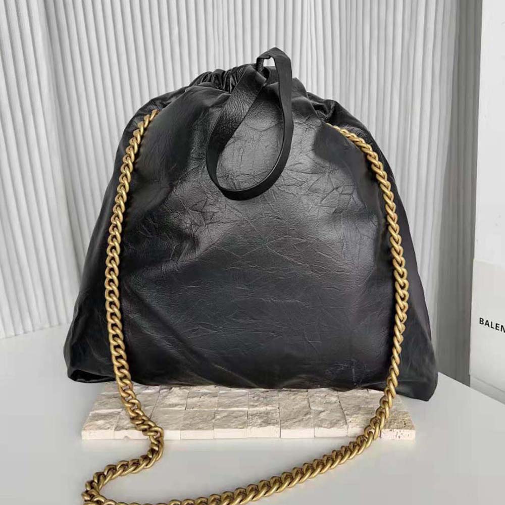 Side angle showcasing the structured silhouette of Balenciaga Women Crush Medium Tote Bag