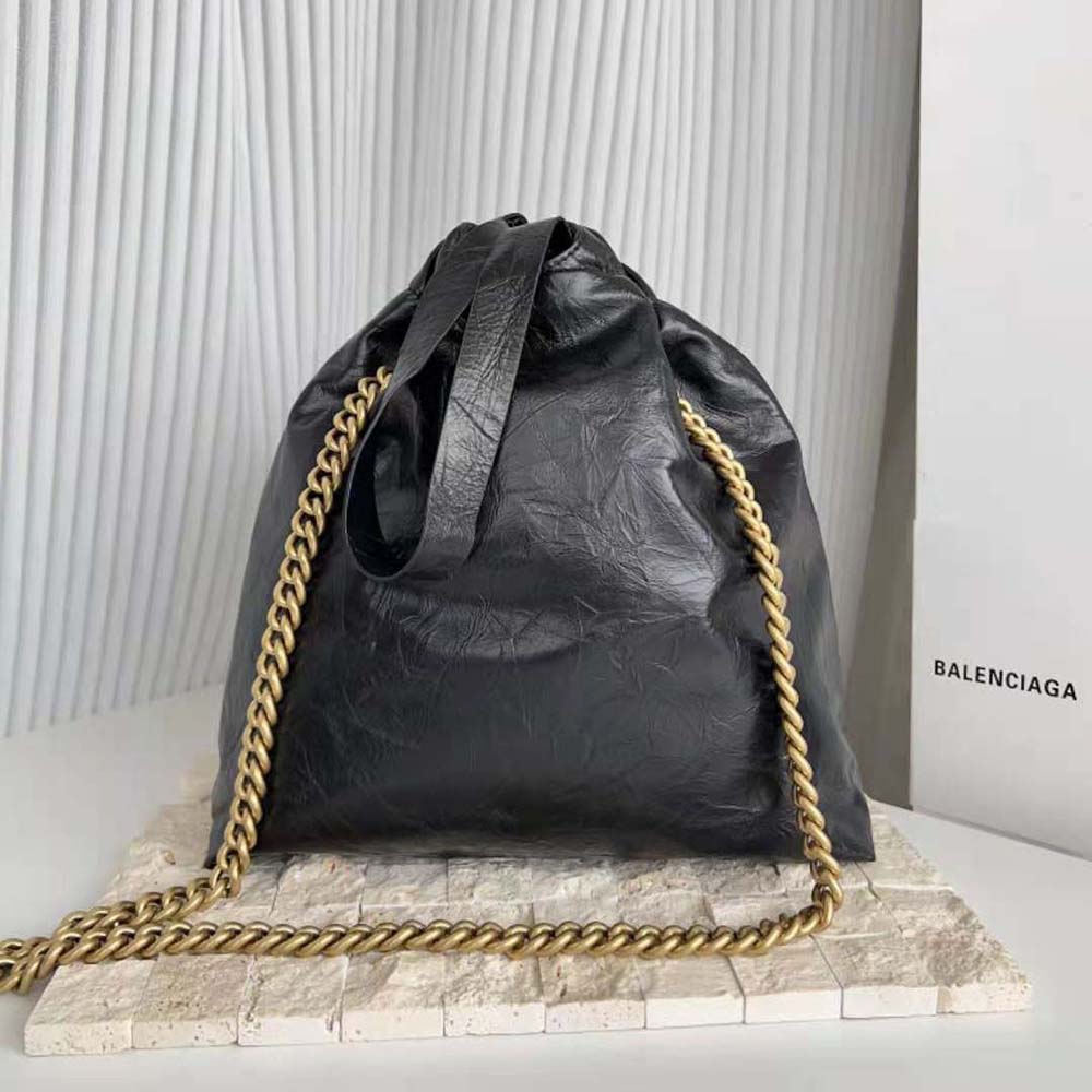 Side angle showing compact silhouette of Balenciaga Women Crush Small Tote Bag