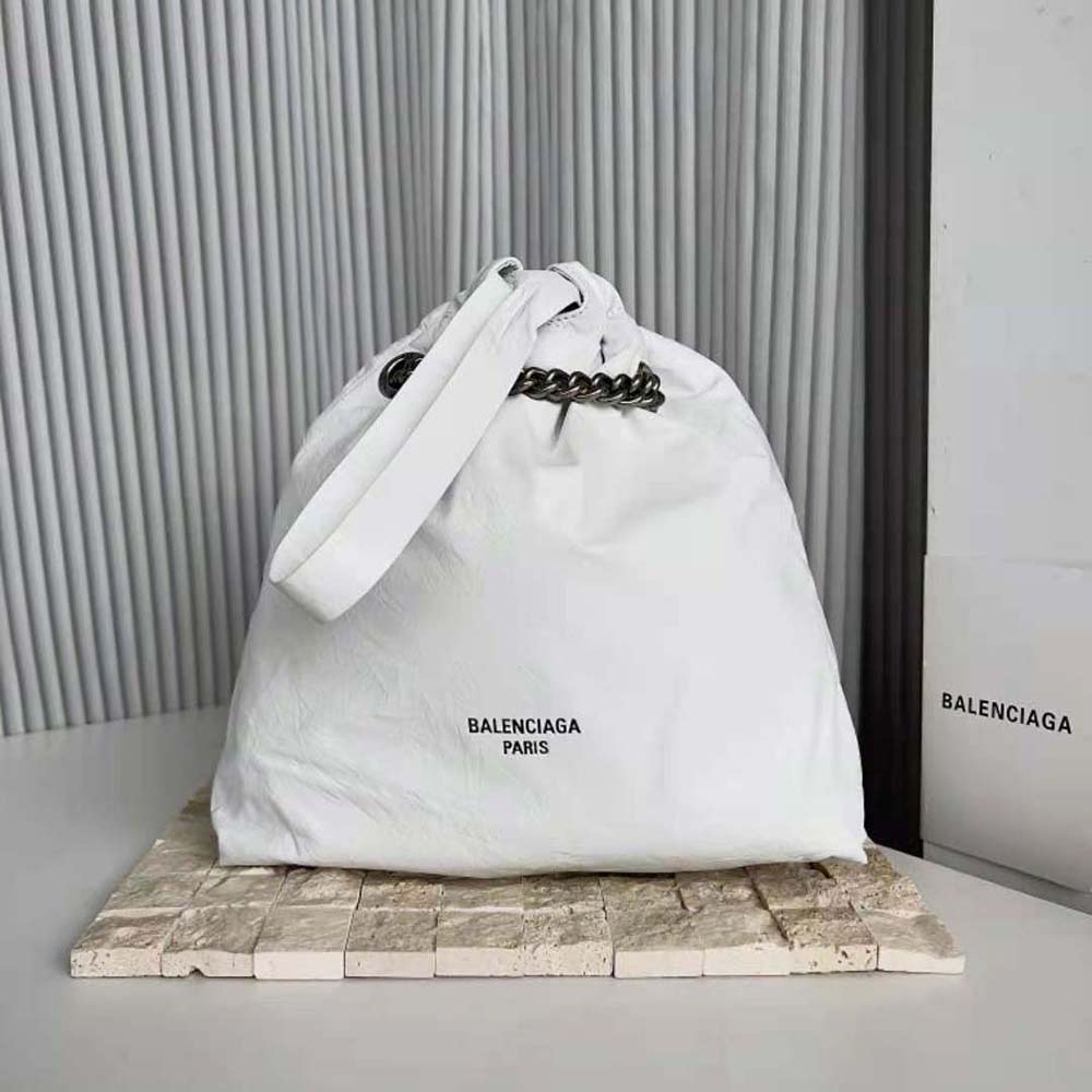 Close-up of silver hardware and magnetic closure on Balenciaga white tote