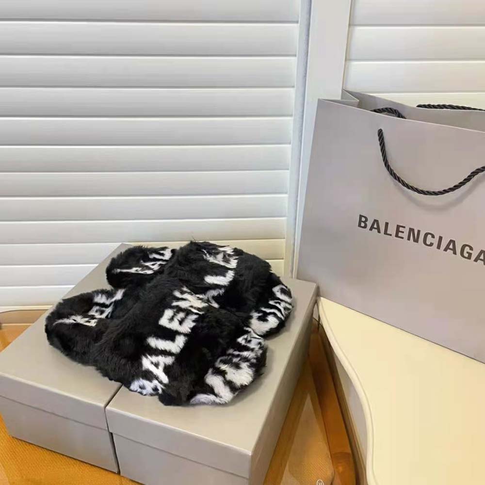 Close-up on fake fur and allover logo print on Balenciaga womens sandal