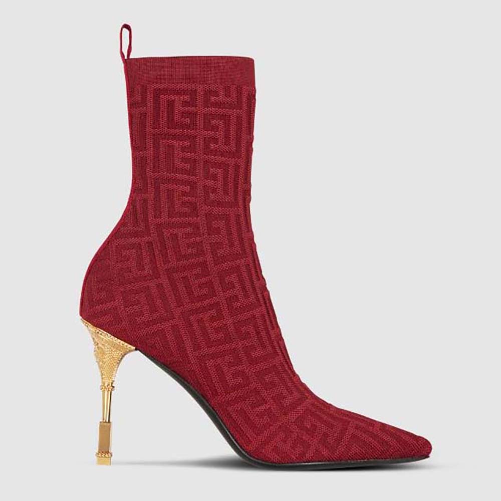 Side view of Balmain Women Moneta Monogrammed Knit Ankle Boots with Engraved Heel-Red