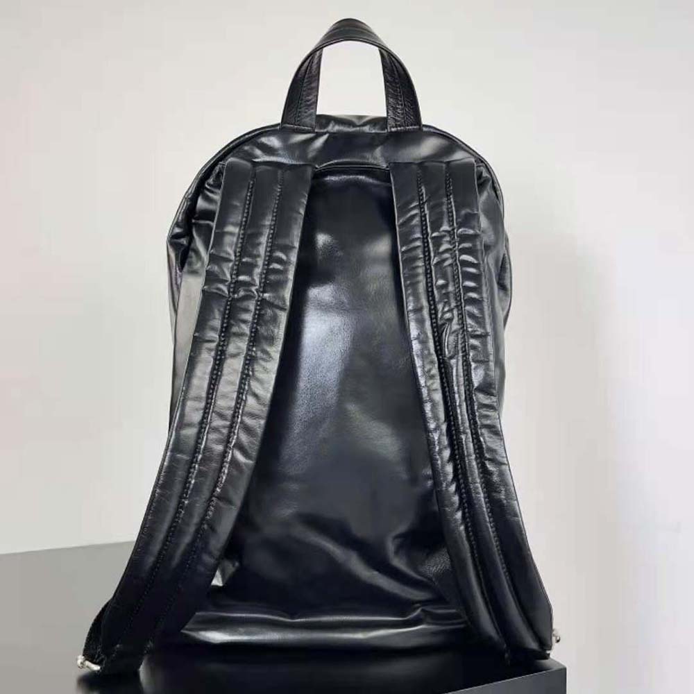 Side angle showing matte black hardware on Bottega Veneta Men Medium Archetype Backpack