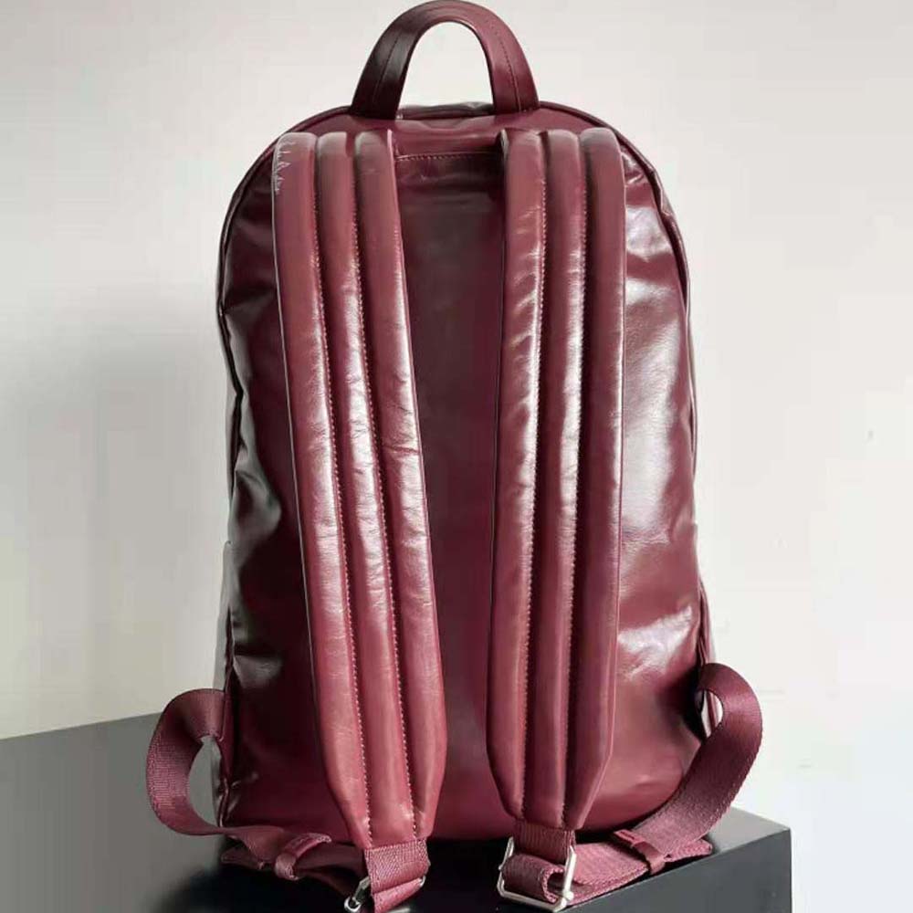 Side profile showing silhouette of Bottega Veneta Men Medium Archetype Backpack maroon leather