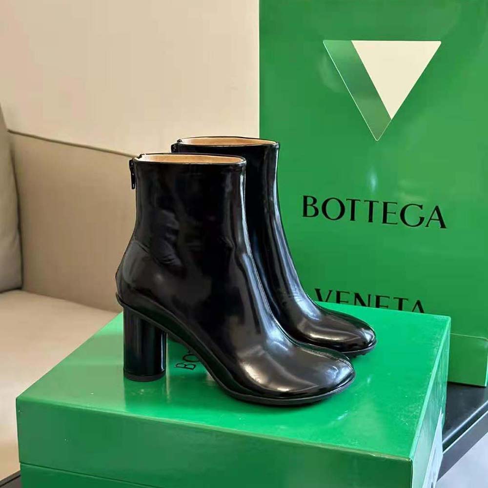 Rear angle highlighting sculptural heel and sleek silhouette of Atomic Ankle Boot