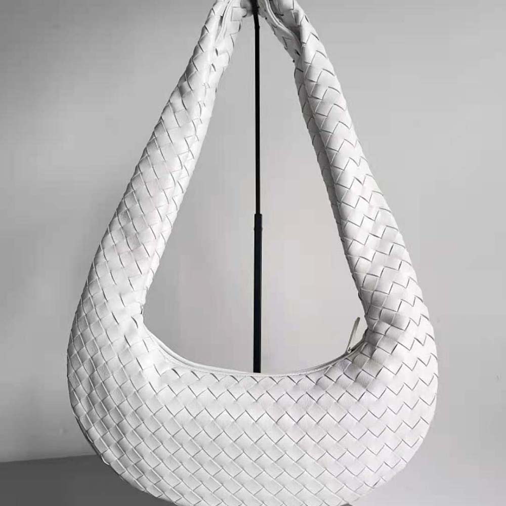 Close-up of woven intrecciato leather detail on Bottega Veneta crossbody bag