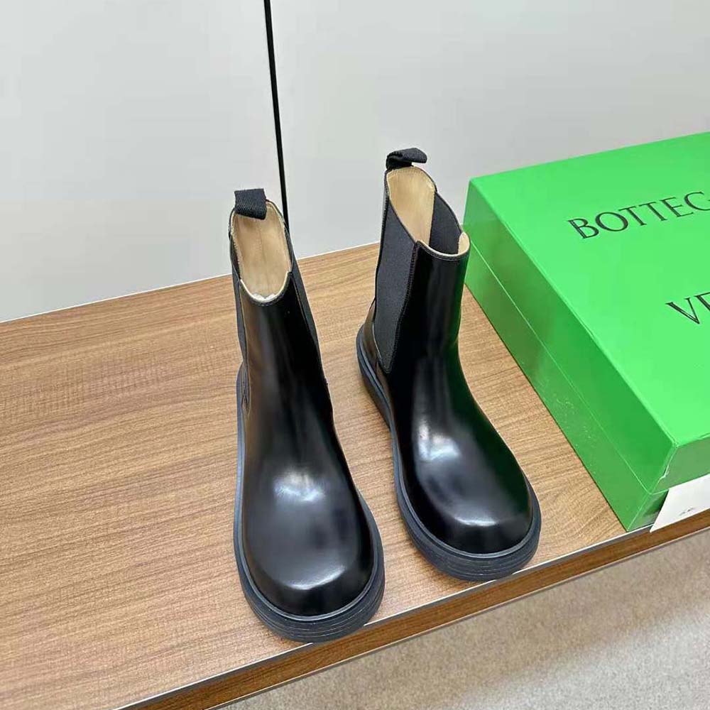 Close-up on elastic panel detail on Bottega Veneta black ankle boot