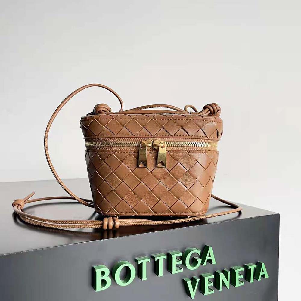 Close-up of brown woven leather texture on Bottega Veneta mini vanity case