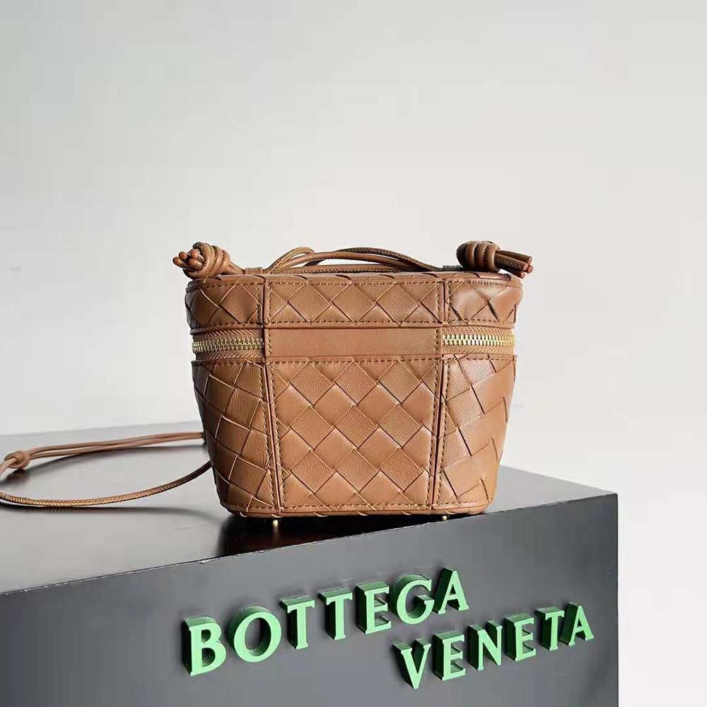 Side angle showing gold hardware and strap attachment on Bottega Veneta vanity case
