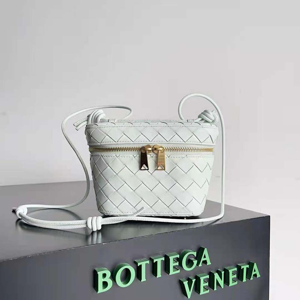 Close-up of intrecciato leather texture and zip on Bottega Veneta mini vanity case