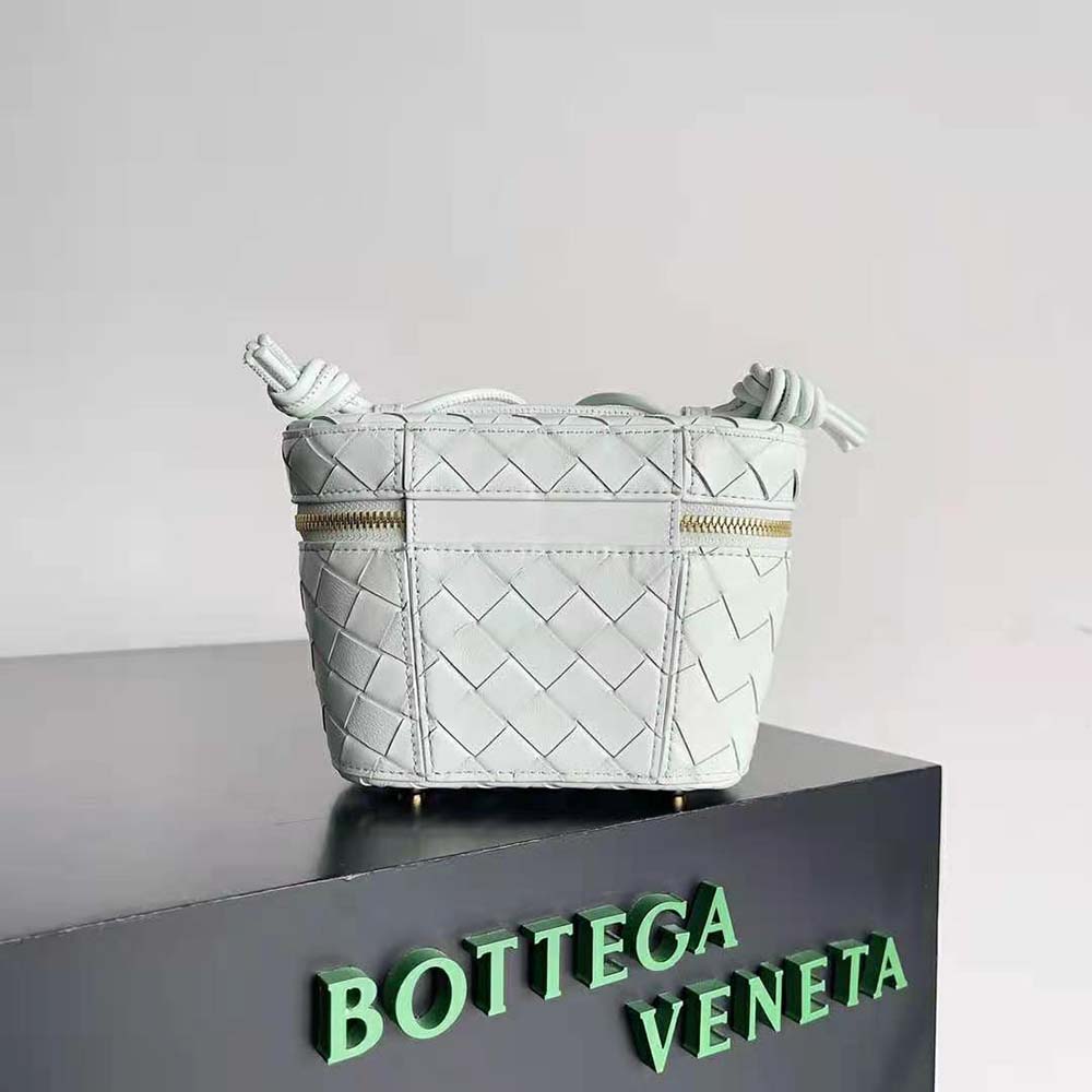 Side angle showing adjustable cross-body strap on Bottega Veneta white shoulder bag