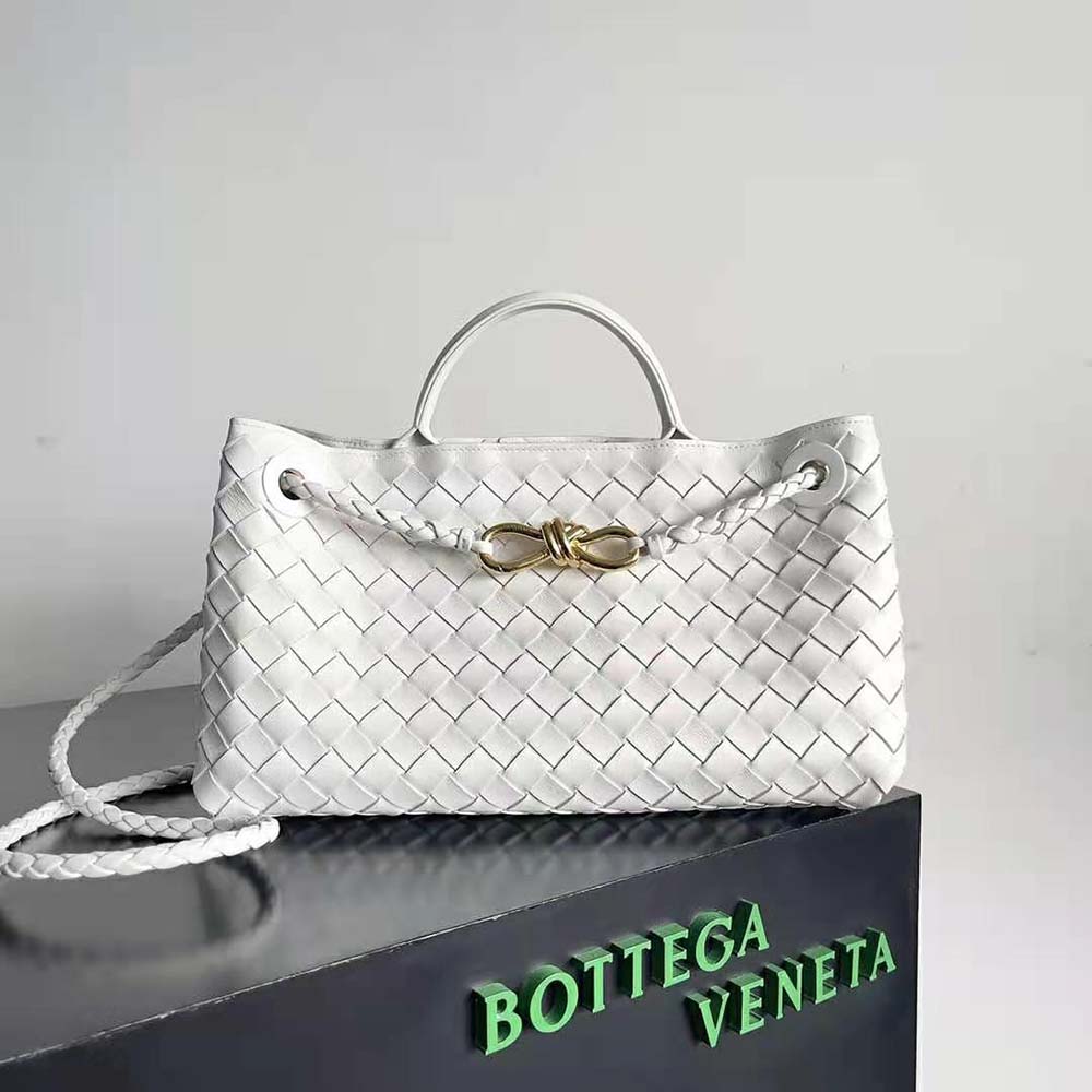 Close-up of intrecciato weave and gold buckle on Small East/West Andiamo-White