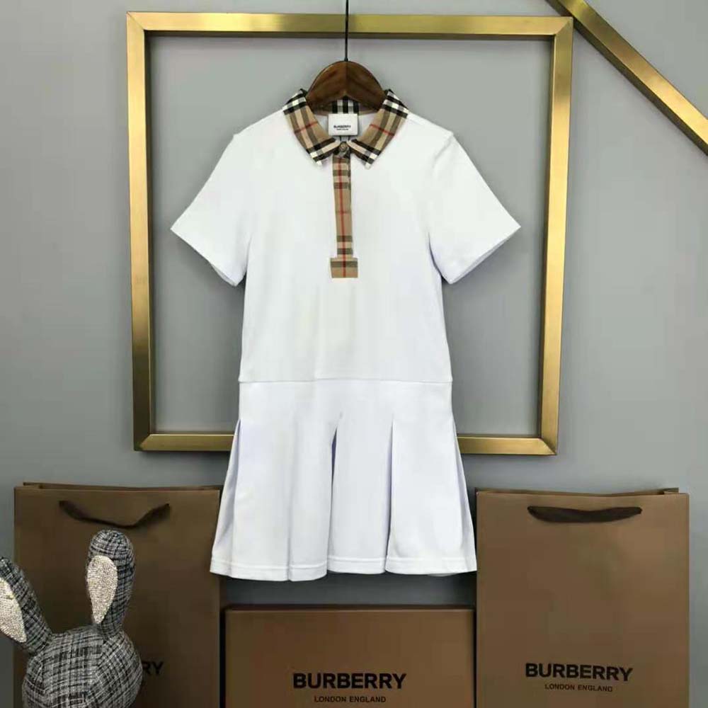 Close-up of vintage check trim detail on Burberry girls’ polo shirt dress