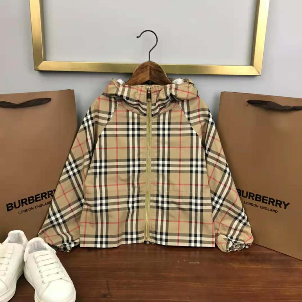 Close-up detail of Burberry check lining inside the kids’ hooded jacket