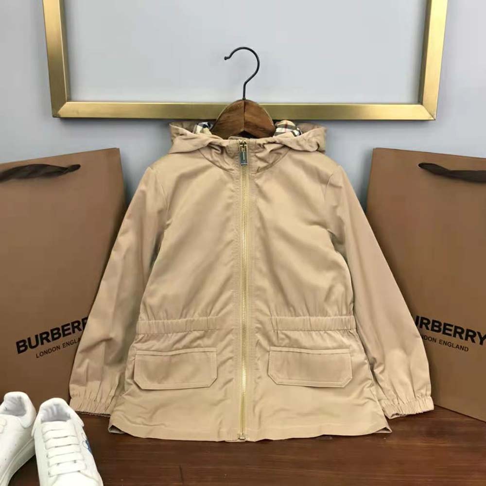 Side angle showing zip closure and hood on Burberry Kids’ cotton jacket