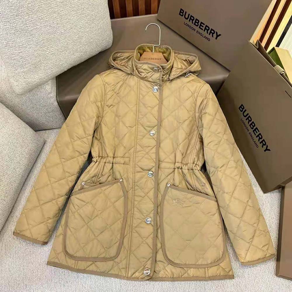 Close-up of diamond quilting and branded hardware on Burberry jacket