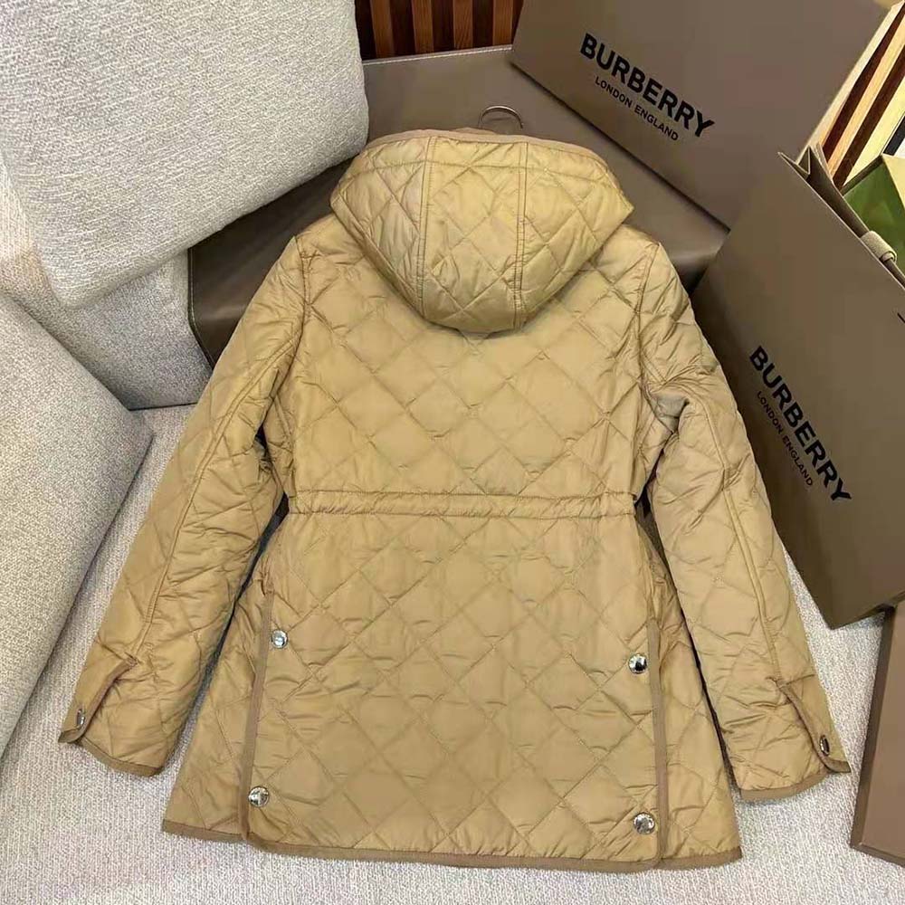 Side profile showing tailored fit of Burberry Women Diamond Quilted Nylon Jacket-Brown