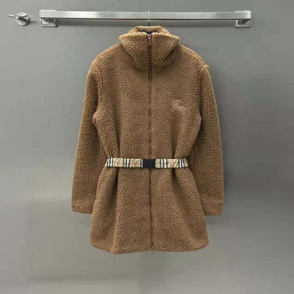 Close-up of brown fleece fabric and branded zipper on Burberry jacket