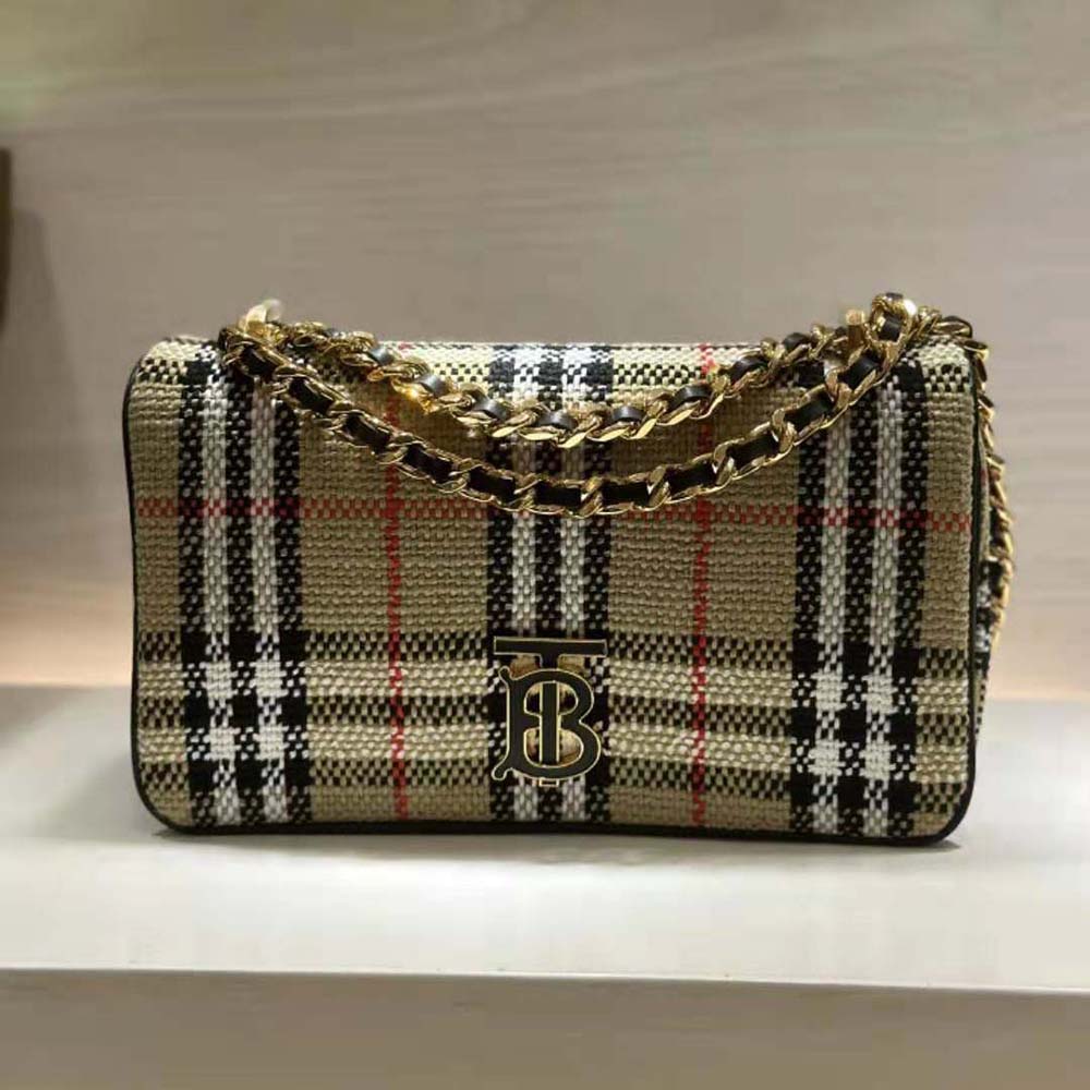 Close-up of gold hardware and signature check detail on Small Lola Bag