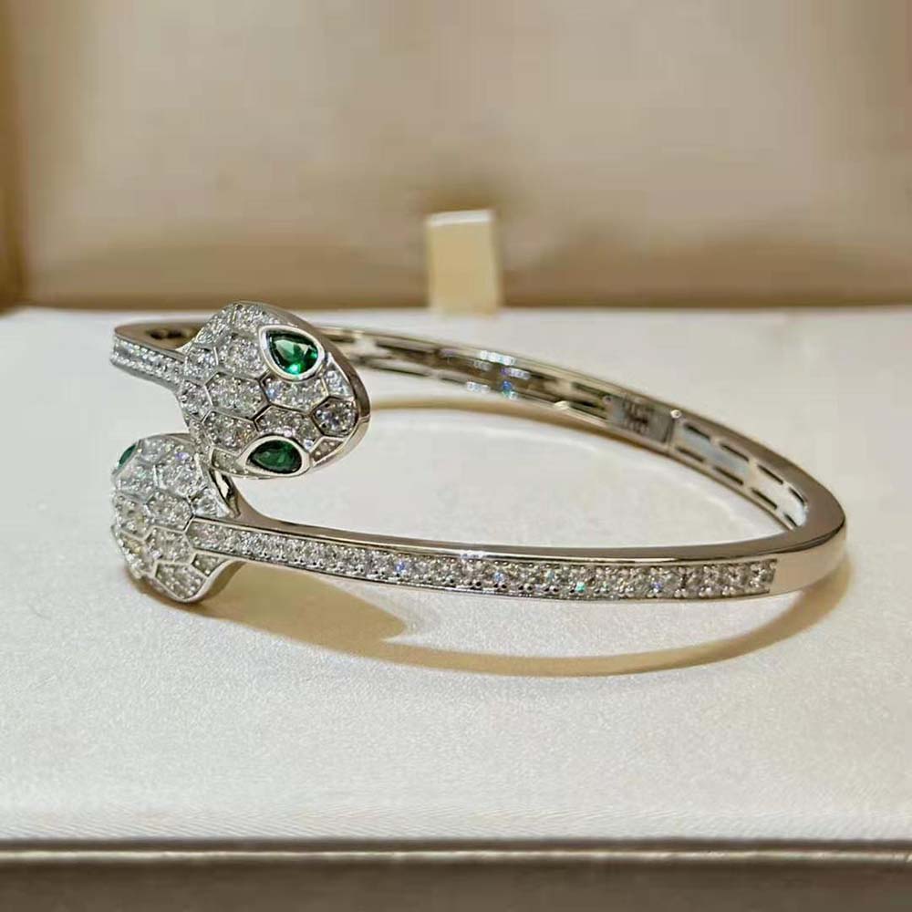Detailed shot of signature Bvlgari logo on Serpenti bracelet set in white gold