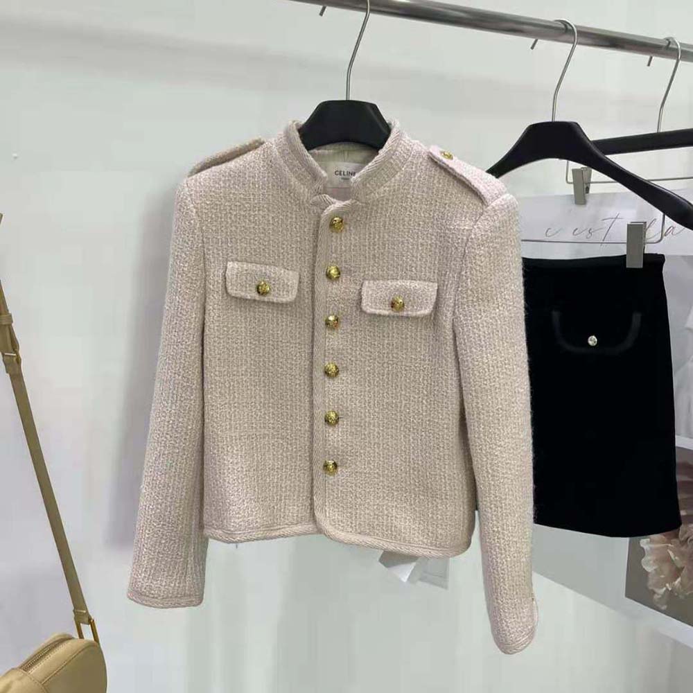 Close-up of textured bouclette fabric and brass buttons on Celine jacket