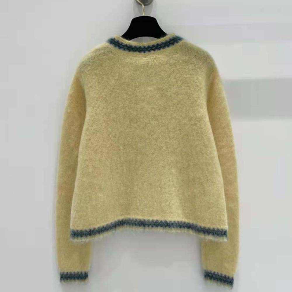 Close-up on signature buttons of Celine Women Cardigan Jacket in Mohair