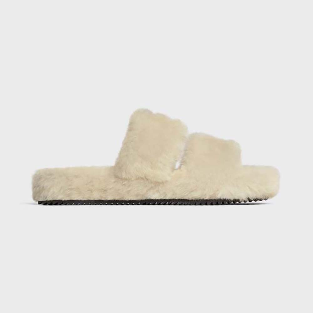 Front angled view of Celine Women Fur Slides Triomphe Open Slides in white shearling