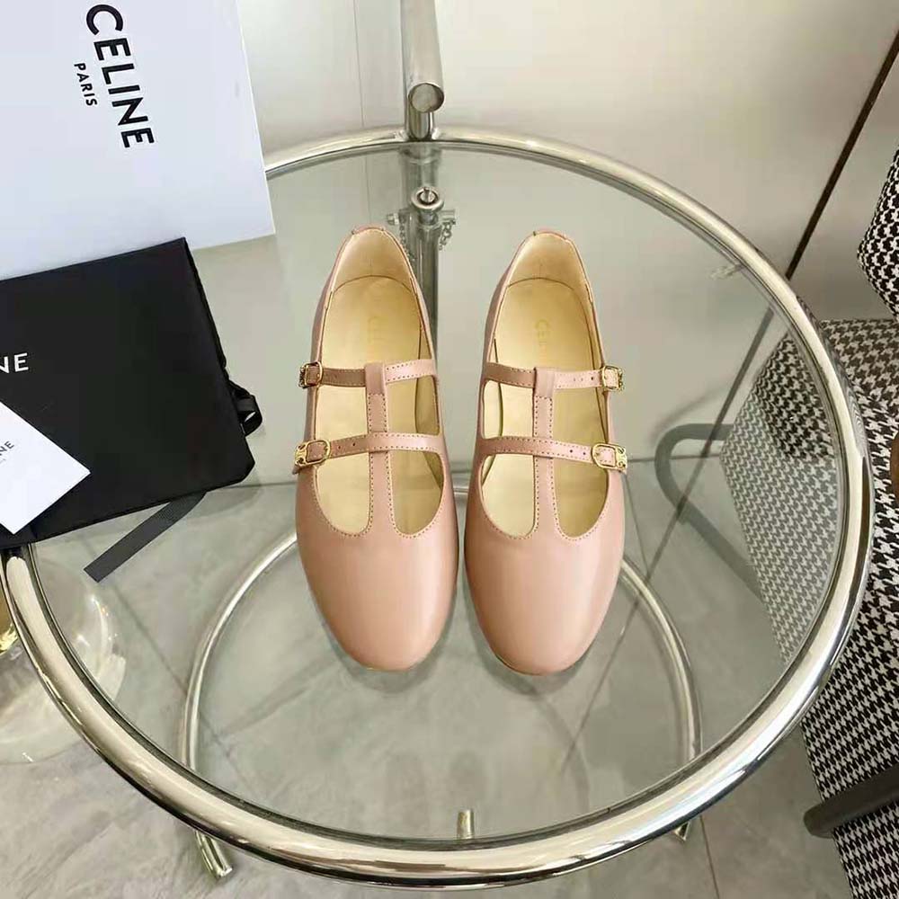 Close-up on double straps and gold-tone hardware of Celine Mary Jane shoes