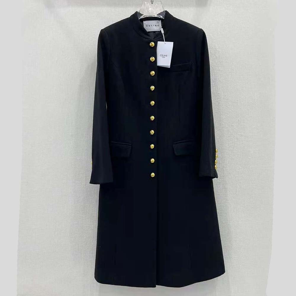 Close-up of Celine metal buttons on black military wool coat