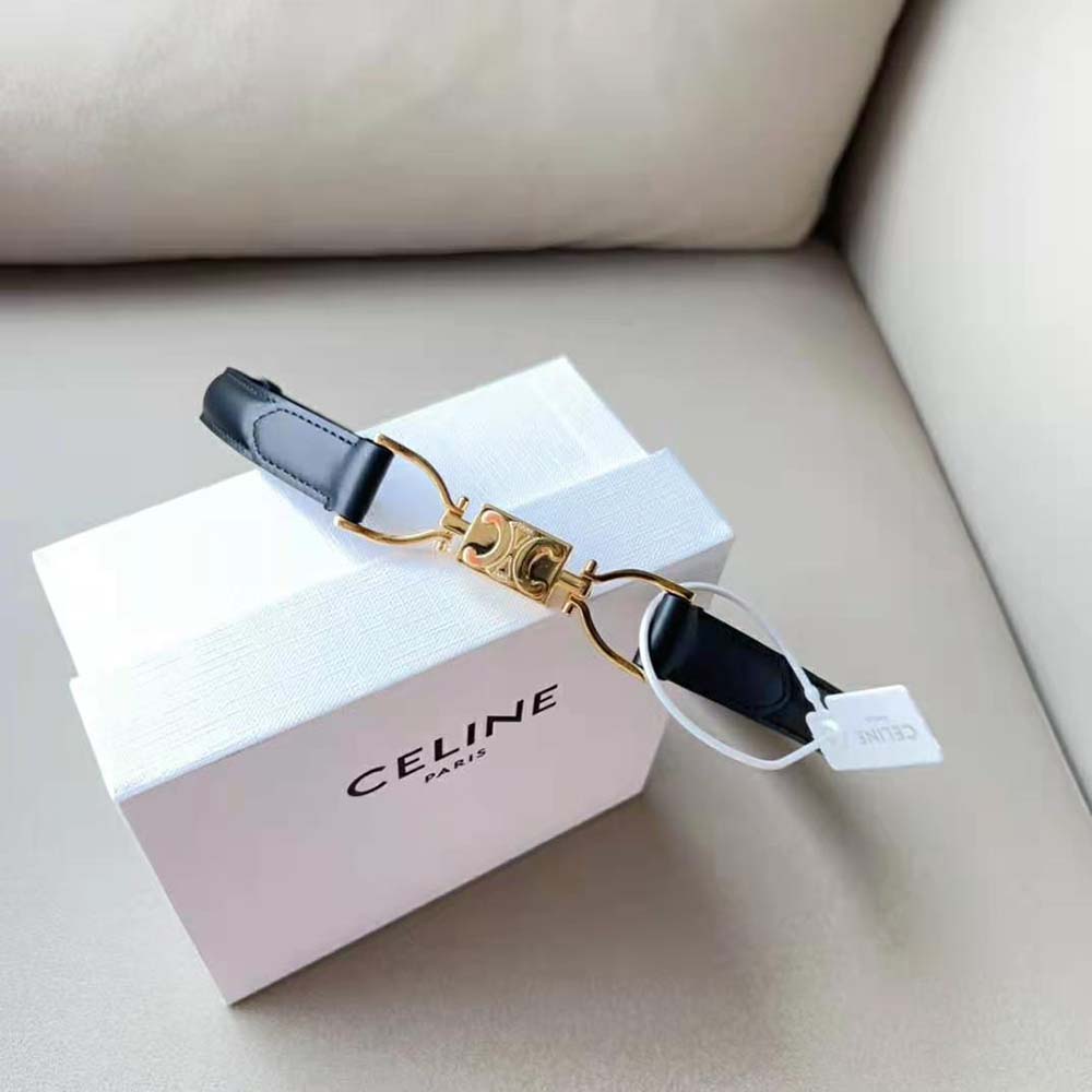 Close-up of gold-tone Triomphe buckle on Celine Women Small Block Triomphe Belt