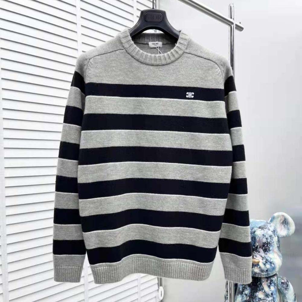 Close-up of silver striped wool and Triomphe logo detail on sweater