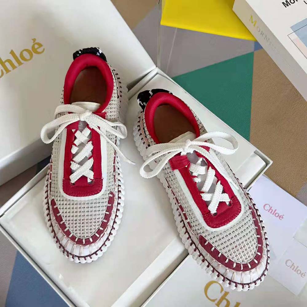 Top angle highlighting lace-up closure on Chloe Unisex Nama Sneaker-Red