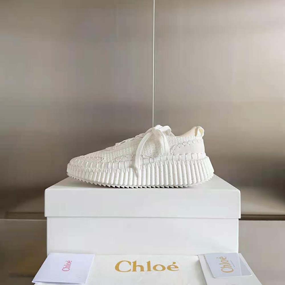 Close-up of embossed Chloé logo on heel of Nama Sneaker-White