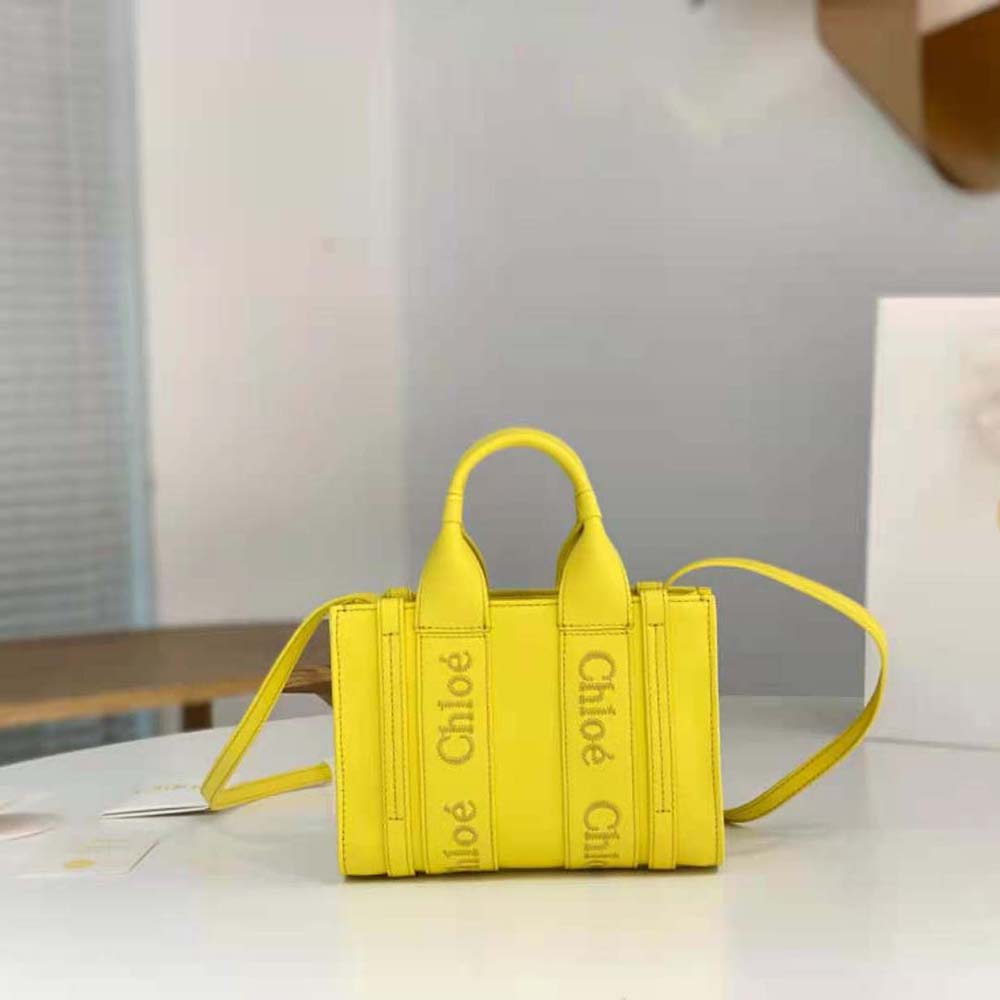 Close-up of yellow leather texture and gold hardware on Chloe Women Mini Woody Tote Bag-Yellow