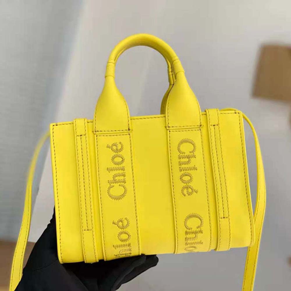 Side angle showing mini tote silhouette of Chloe Women Mini Woody Tote Bag-Yellow