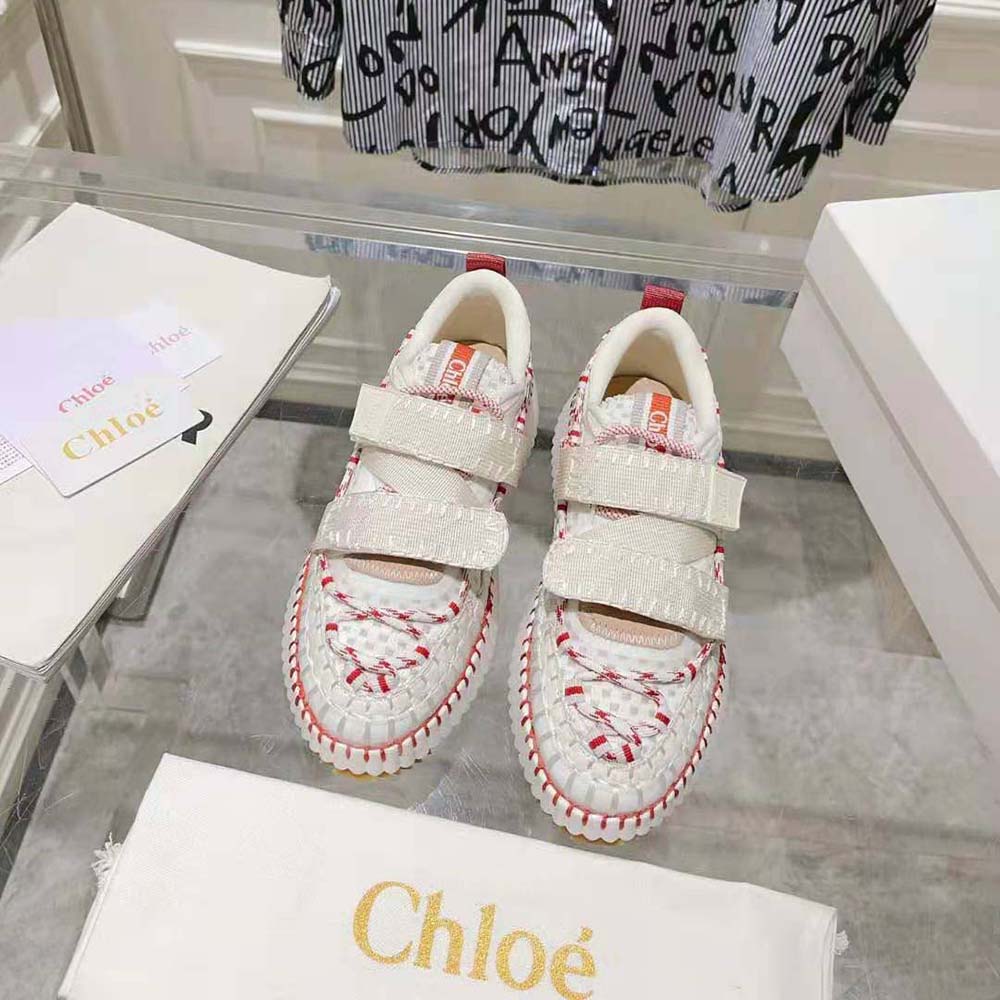 Close-up of elastic gusset and gold logo on Chloe Nama sneaker