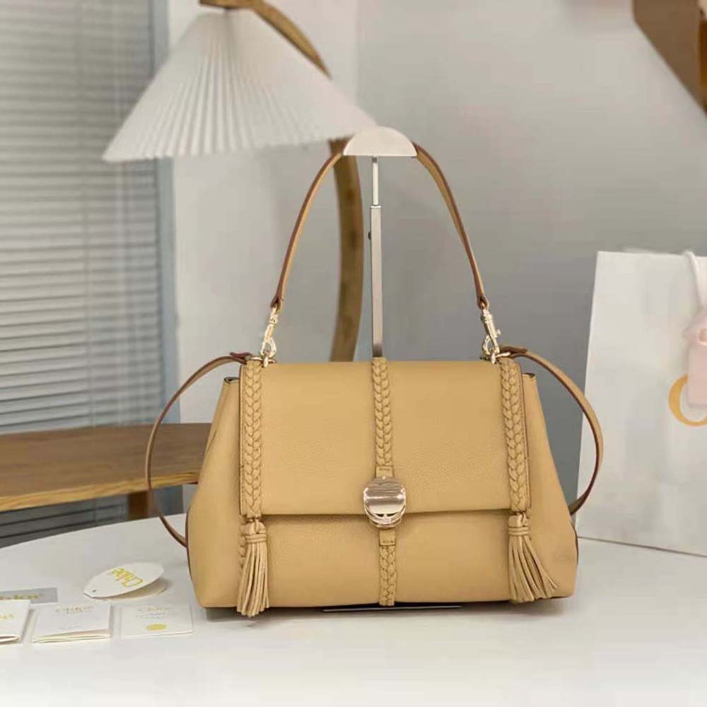 Close-up of gold chain and logo hardware on Chloe Women Penelope Medium Soft Shoulder Bag-Gold